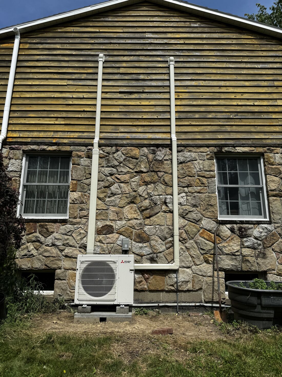 Ductless mini-split on a stone patio