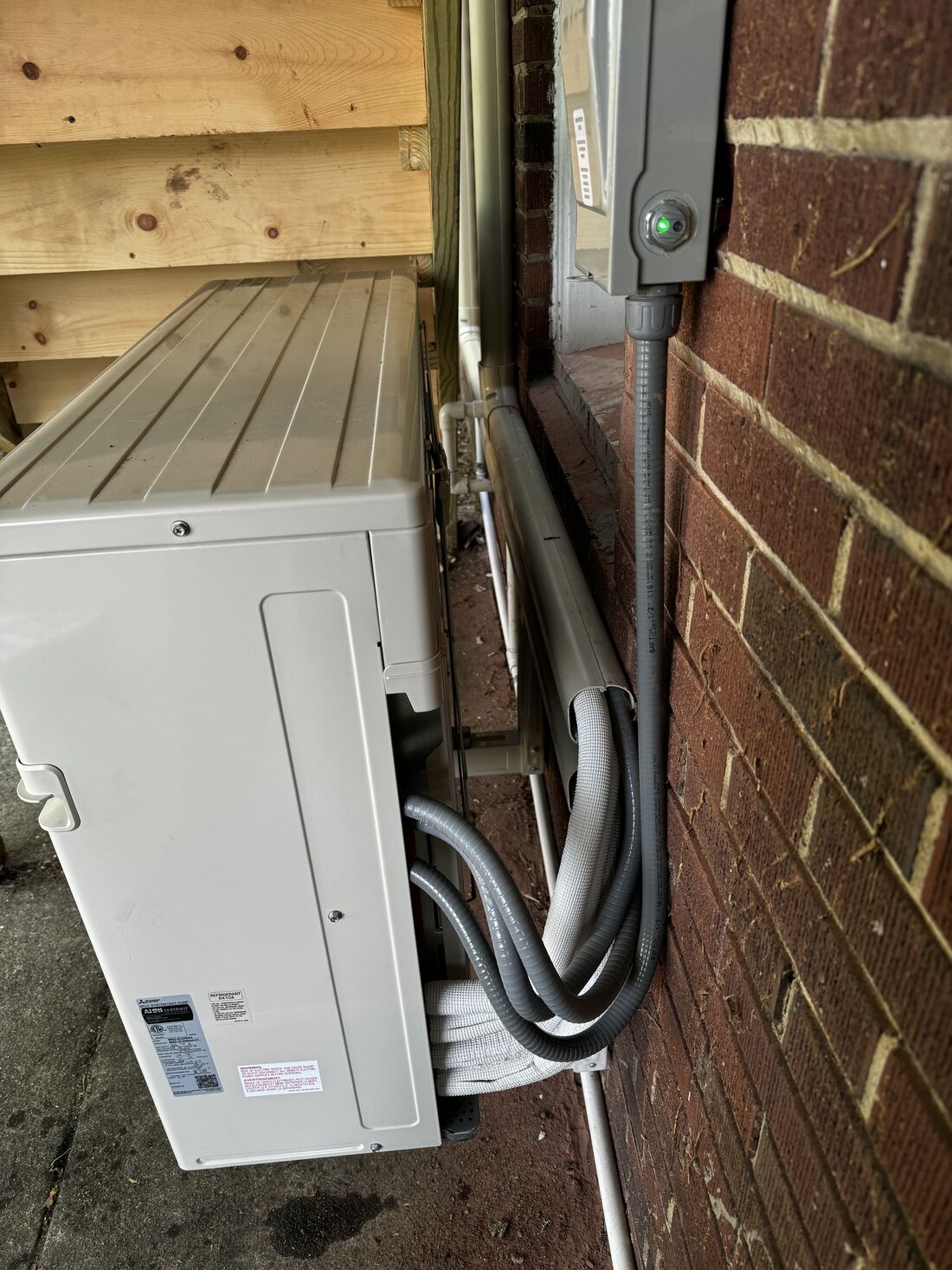 Neat condenser install on a residential deck