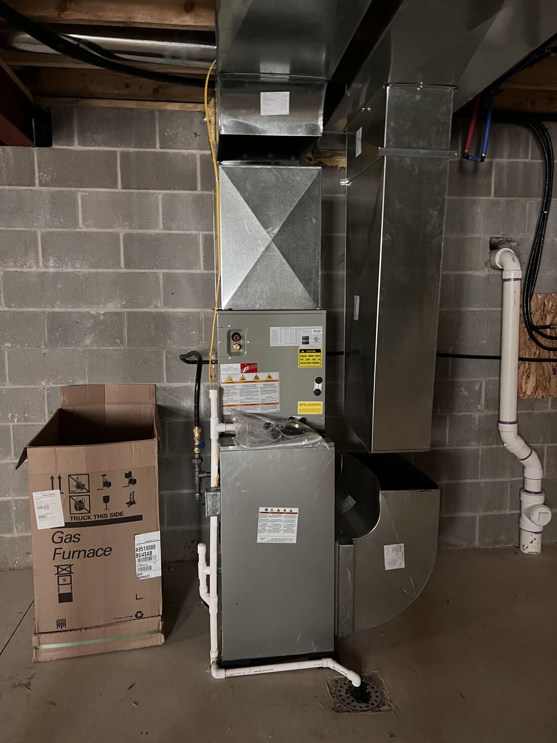 Vertical furnace install in a finished basement